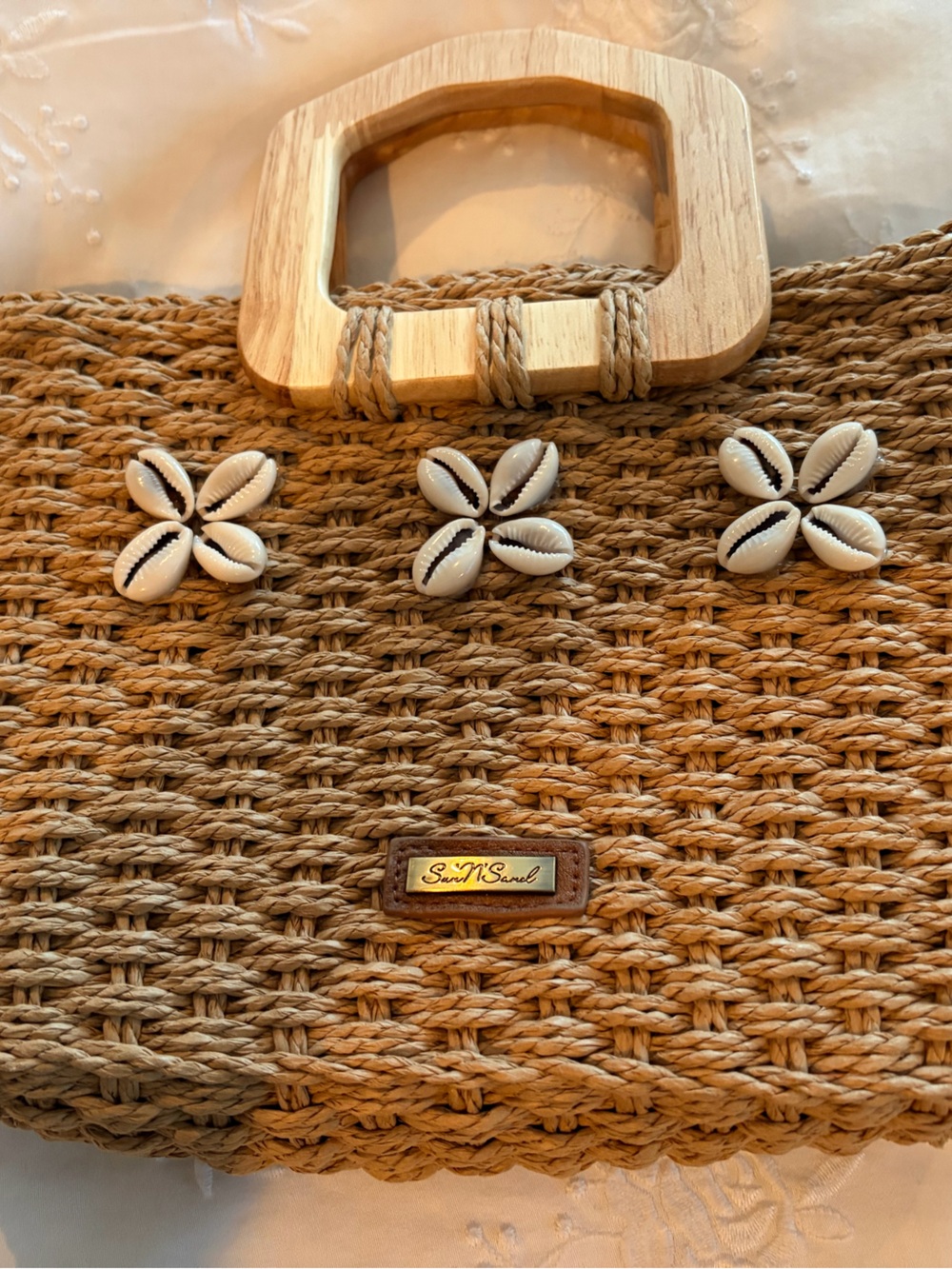 Sea-inspired Woven Straw Clutch with Shell Accents - wooden handle